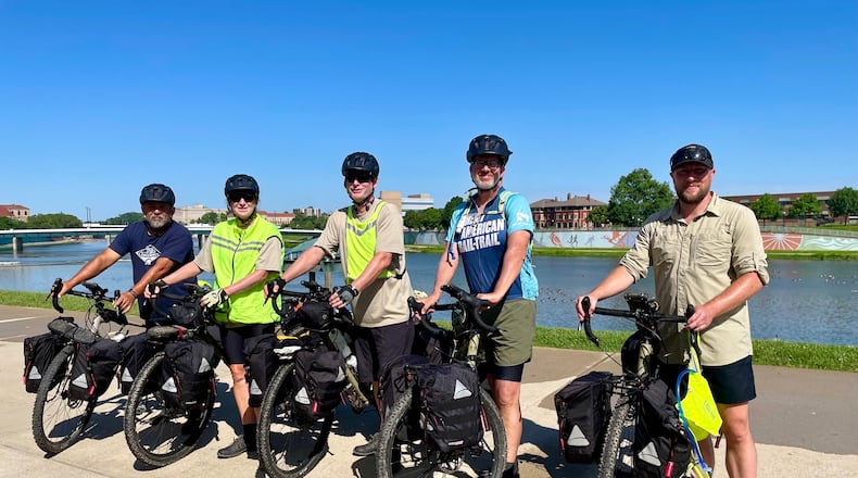 Great American Trail-Rail Veterans Joseph De La Garza, Allison Garrigus, Alan Garrigus, Jay Waters and Paul Cook recently stopped in Dayton as part of their 3,700-mile journey - Debbie Juniewicz