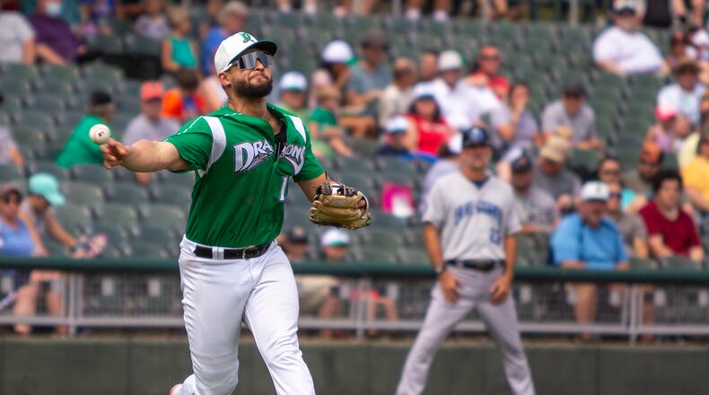 Dragons third baseman Juan Martinez fires to first base after fielding a bunt in the second inning of Sunday's game against Lake County at Day Air Ballpark. Jeff Gilbert/CONTRIBUTED