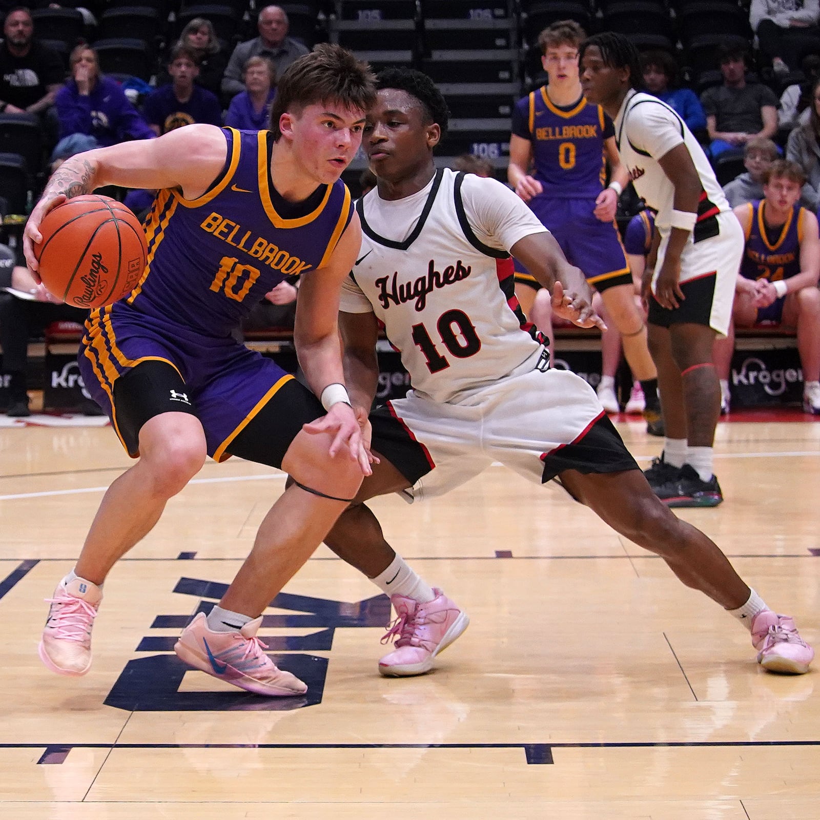 Bellbrook High School's Aidan Caswell is guarded by Hughes' Jaionte Jones during their Division III district final game on Saturday, March 7, 2026 at the University of Dayton Arena. BELLBROOK LOCAL SCHOOLS / CONTRIBUTED PHOTO