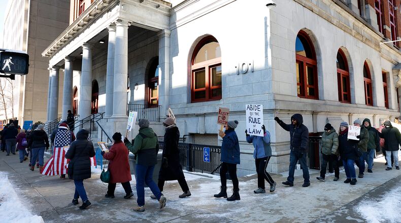Protesters gathered outside Dayton City Hall Monday, Feb. 17, 2025 for a "Not My Presidents Day" rally – part of a nationwide effort to protest the policies of the Trump administration. It's part of the 50-50-1 movement, which stands for 50 states, 50 protests, 1 movement. MARSHALL GORBY\STAFF