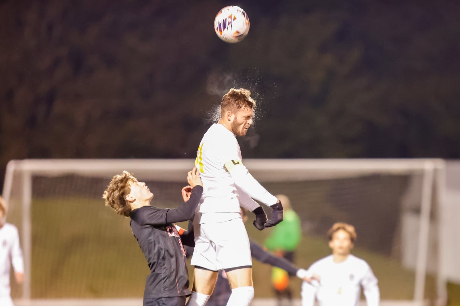 Centerville High School senior Owen Mace heads the ball during their Division I regional final match against Columbus St. Charles on Sunday, Nov. 2 at Wright State University's Alumni Field. The Cardinals won 2-0. MICHAEL COOPER / STAFF PHOTO