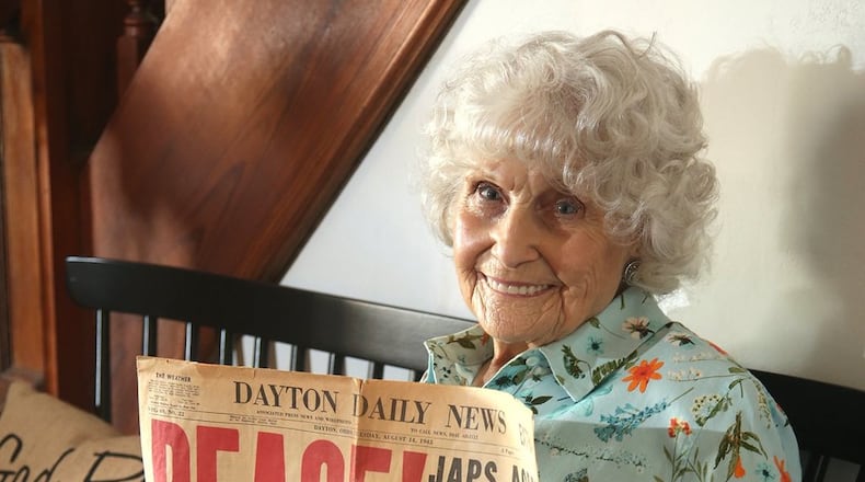 Joy Jones of New Lebanon saved a copy of the Aug. 14, 1945 edition of the Dayton Daily News that marked the end of World War II. LISA POWELL / STAFF