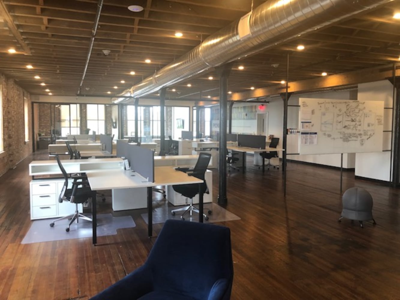 PHOTOS: Inside the new downtown Dayton office that has an industrial slide
