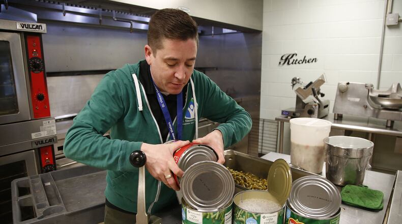 Wayne Morris works as a cook at St. Vincent de Paul shelter in Dayton. Morris regularly makes food for more than 100 people a day. The shelter relies on food and clothing donations to assist its guests. TY GREENLEES / STAFF
