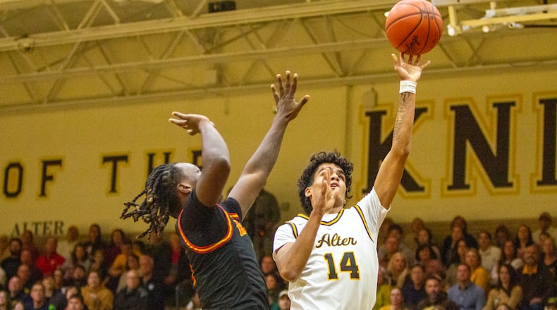 Alter's R.J. Greer tries to score in the first half Friday night against visiting Fenwick. Jeff Gilbert/CONTRIBUTED