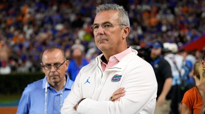 FILE - Former Florida head coach Urban Meyer watches the first half of an NCAA college football game between Florida and Tennessee, Saturday, Nov. 22, 2025, in Gainesville, Fla. (AP Photo/John Raoux, File)