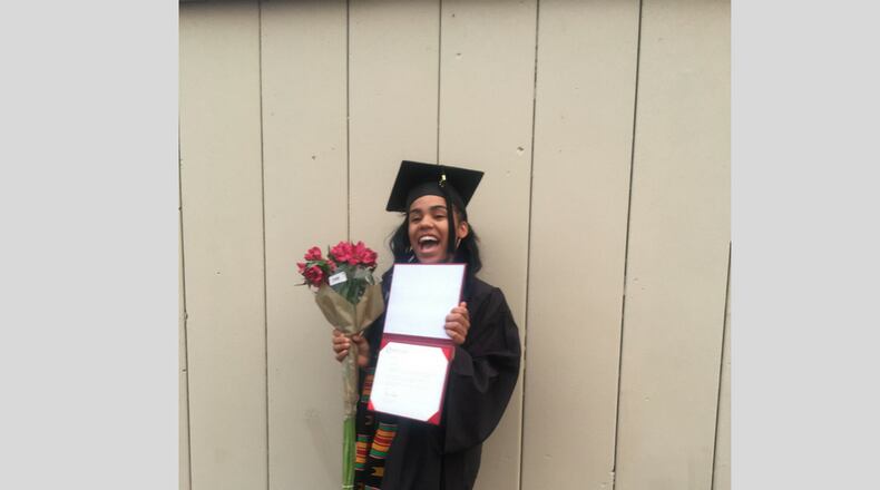 Ashli Garnett  is the first student at Paul Laurence Dunbar Early College High School to earn an Sinclair Community College associate's degree as part of a partnership between the high school and the college.