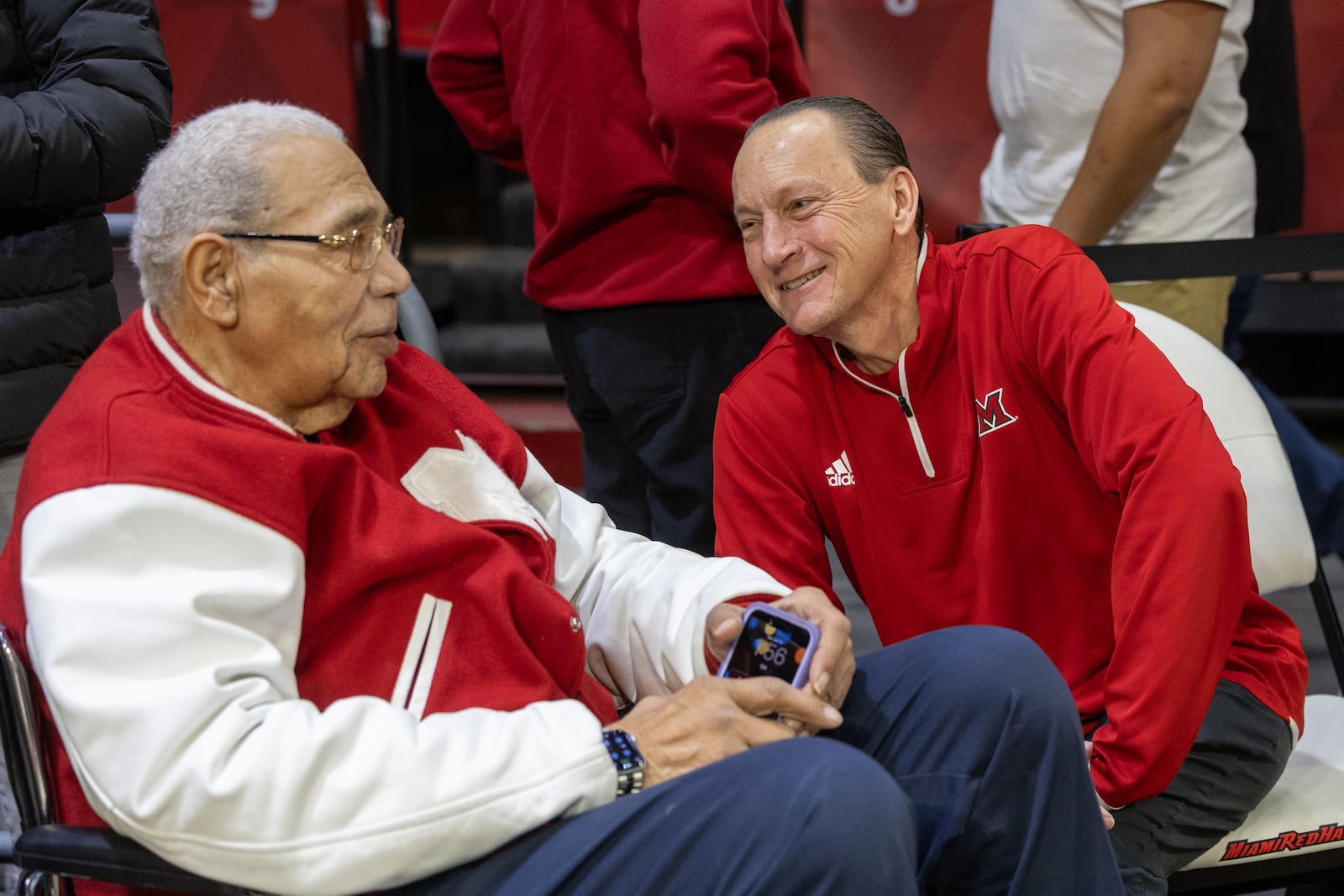 Miami University athletic director David Sayler sits with Miami legend Wayne Embry during the One Miami Day event on Jan. 6, 2026 at Millett Hall in Oxford. CONTRIBUTED PHOTO