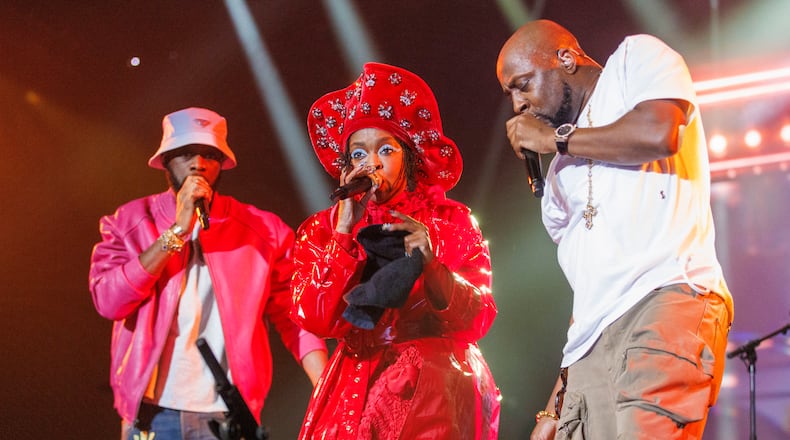 Prakazrel “Pras” Michel, from left, Lauryn Hill and Wyclef Jean, of the Fugees, perform during "The Miseducation of Lauryn Hill" 25th anniversary tour on Sunday, Nov. 5, 2023, at the Kia Forum in Inglewood, Calif. (Photo by Willy Sanjuan/Invision/AP)