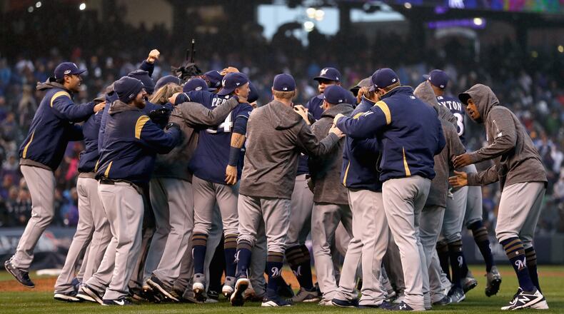 DENVER, CO - OCTOBER 07:  The Milwaukee Brewers  celebrate winning Game Three of the National League Division Series by defeating the Colorado Rockies at Coors Field on October 7, 2018 in Denver, Colorado. The Brewers won the game 6-0 and the series 3-0.  (Photo by Matthew Stockman/Getty Images)