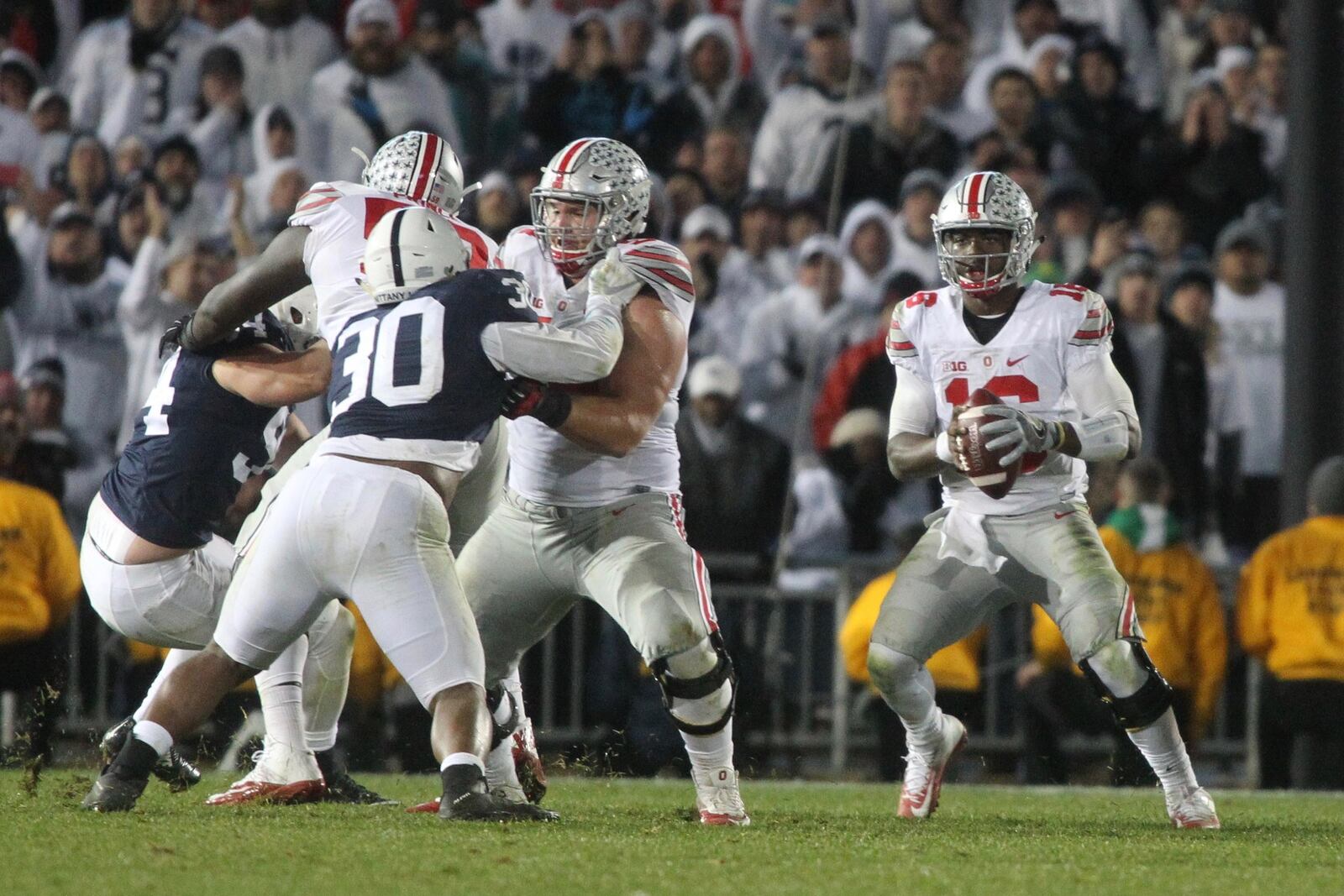 Ohio State’s J.T. Barrett looks for running room before being sacked on Ohio State’s last drive against Penn State on Saturday, Oct. 22, 2016, at Beaver Stadium in State College, Pa. David Jablonski/Staff