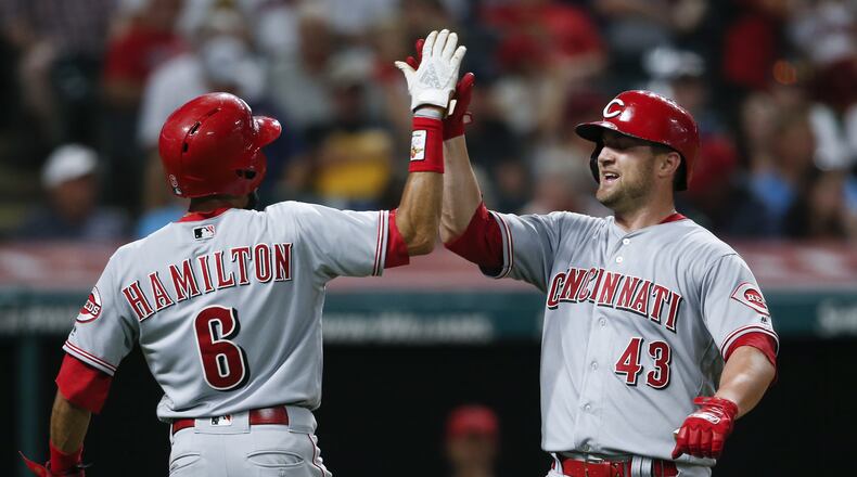 CLEVELAND, OH - JULY 09: Scott Schebler #43 of the Cincinnati Reds celebrates with Billy Hamilton #6 after hitting a two run home run off Josh Tomlin #43 of the Cleveland Indians during the ninth inning at Progressive Field on July 9, 2018 in Cleveland, Ohio. The Reds defeated the Indians 7-5. (Photo by Ron Schwane/Getty Images)