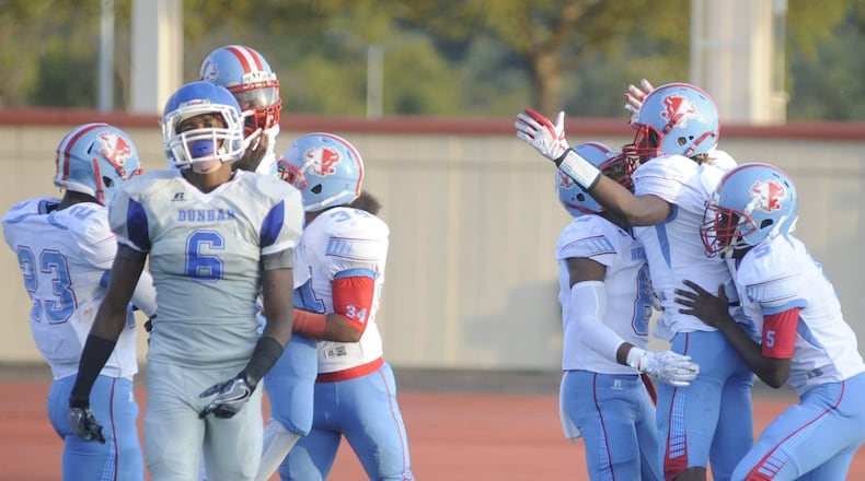 Dunbar and Belmont square off in football in a recent season. FILE PHOTO