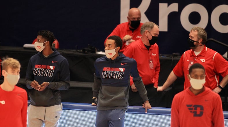 Rodney Chatman watches Dayton warm up before a game against George Mason on Saturday, Jan. 2, 2020, at UD Arena. David Jablonski/Staff