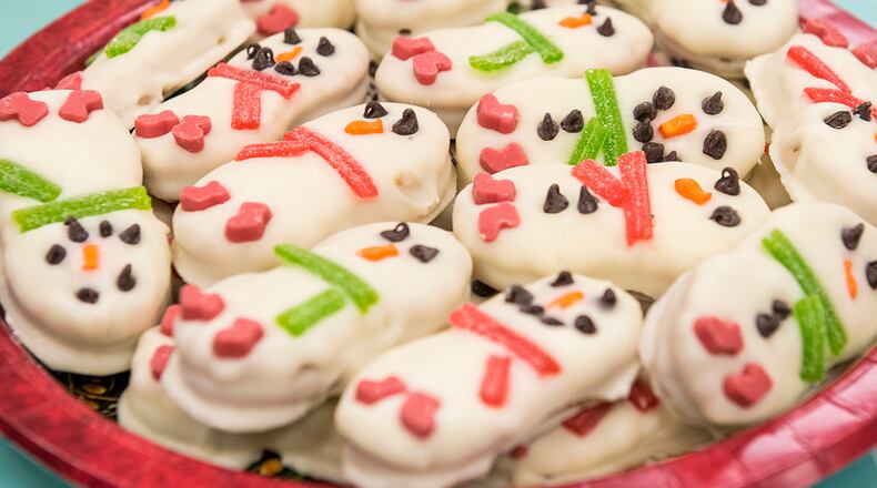 A plateful of snowman-shaped cookies is set for packaging and delivery to unaccompanied Airmen during the 21st annual Airmen Cookie Drive. U.S. AIR FORCE PHOTO/JAIMA FOGG