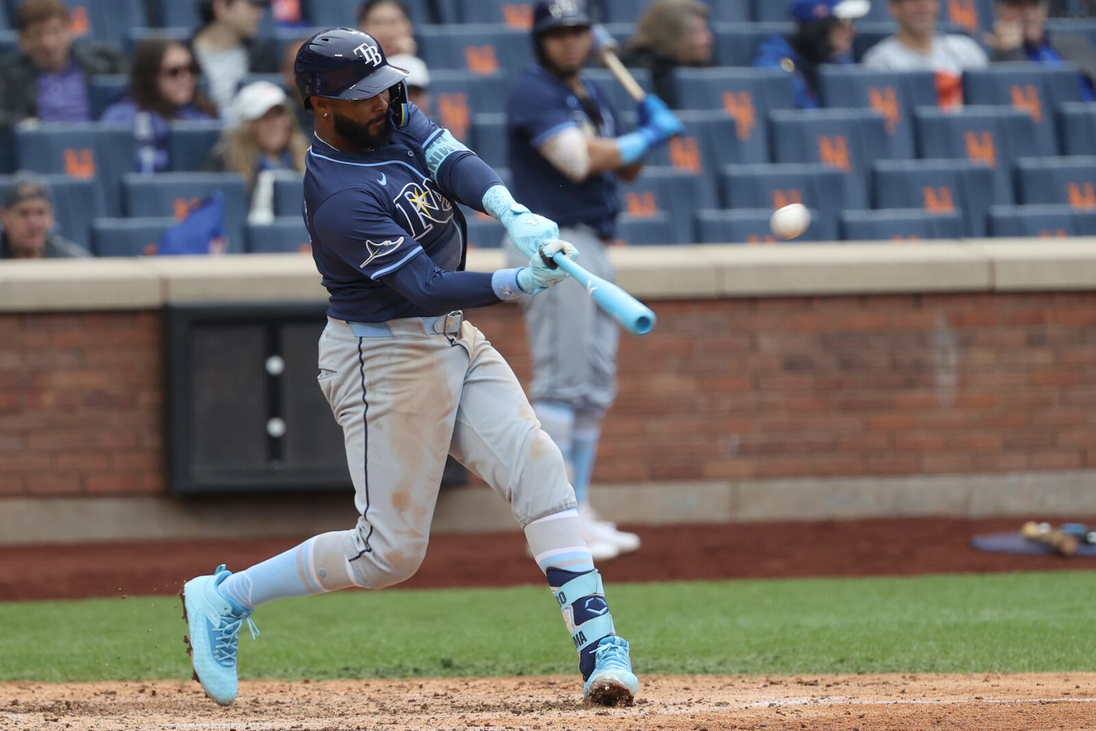 FILE - Tampa Bay Rays' Junior Caminero hits a home run, leading Taylor Walls and Brandon Lowe to score, during the ninth inning of a baseball game against the New York Mets, Sunday, June 15, 2025, in New York. (AP Photo/Pamela Smith, File)