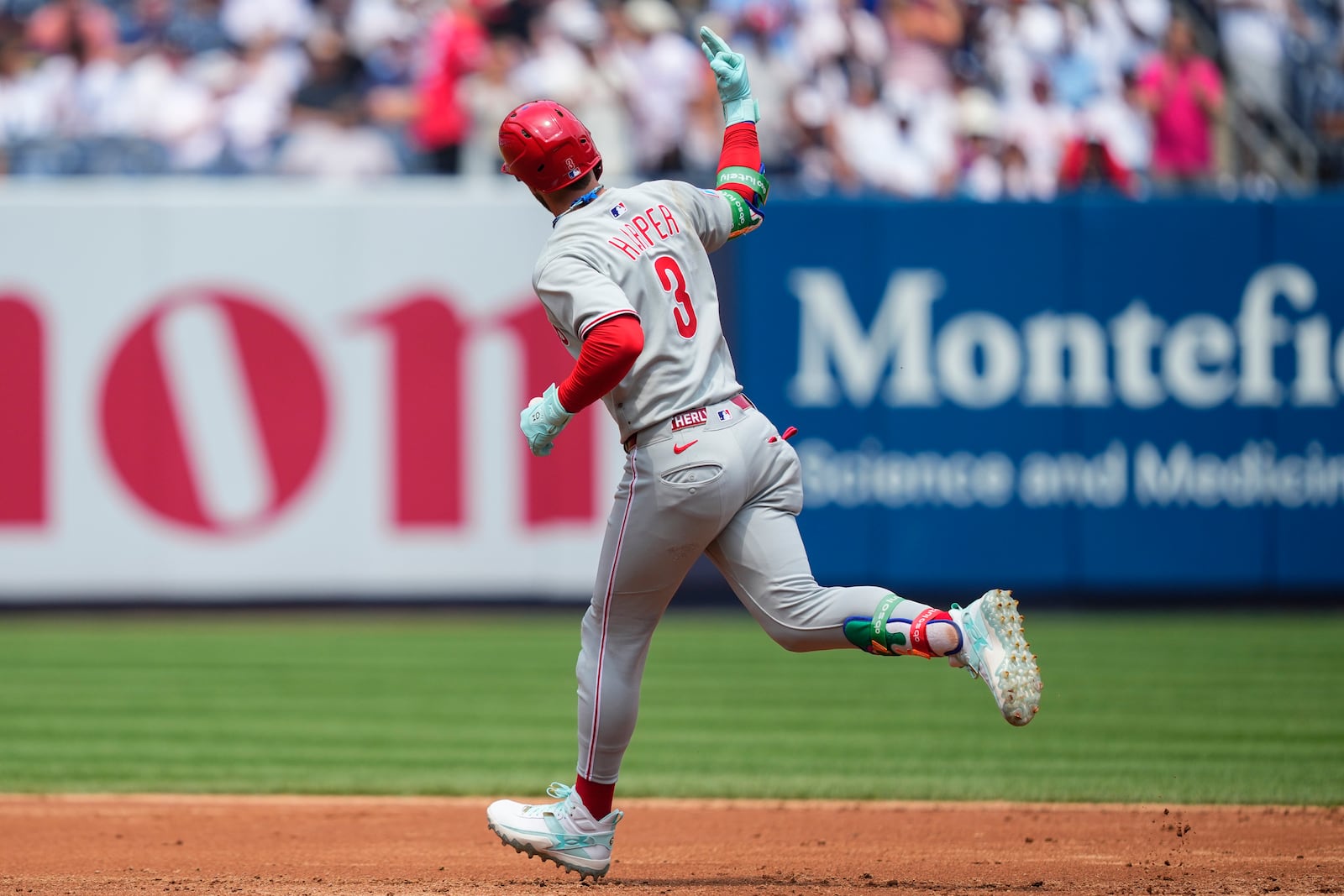 Philadelphia Phillies' Bryce Harper (3) runs the bases after hitting a home run during the third inning of a baseball game against the New York Yankees, Saturday, July 26, 2025, in New York. (AP Photo/Yuki Iwamura)