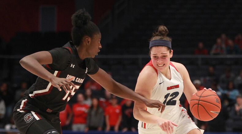 Dayton’s Jenna Giacone dribbles against South Carolina’s Laeticia Amihere on Wednesday, Nov. 13, 2019, at UD Arena. David Jablonski/Staff