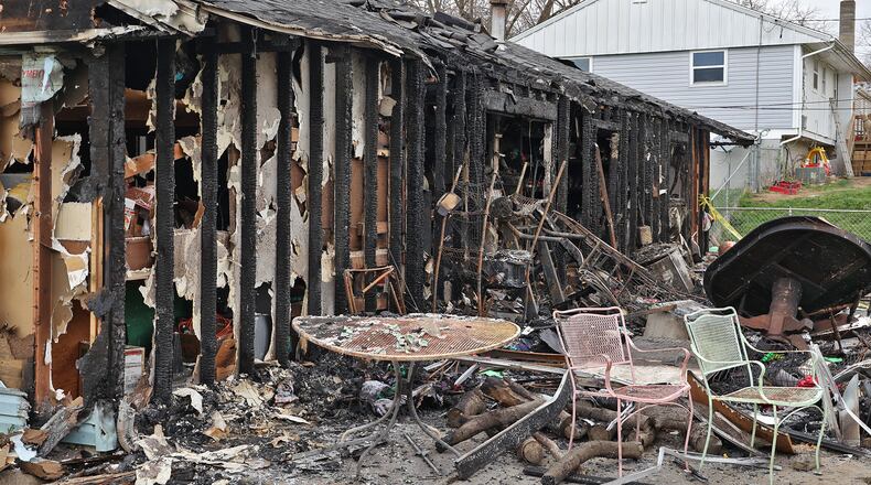 The rear view of the house at 618 Bowser Street shows the extent of the damage Monday after a fire on Sunday destroyed most of the home. BILL LACKEY/STAFF