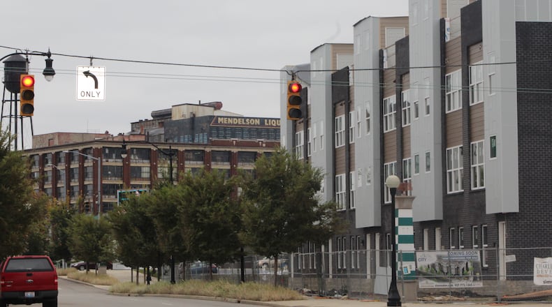 Seven out of the eight City View townhouses under construction, on the right, have been sold. Construction begins on six more within the next 30 days. CORNELIUS FROLIK / STAFF