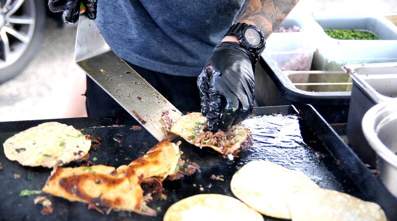 Yellow Cab Tavern kicked off its 10th year of food truck rallies with the Second Annual Birria Fest on Friday, Aug. 4. Birria tacos and other themed food and drinks were featured at the event. Guests also had the opportunity to shop at the Haus of Sequins "Punk Rock Flea". Four local bands provided live music for the evening. DAVID A. MOODIE/CONTRIBUTING PHOTOGRAPHER