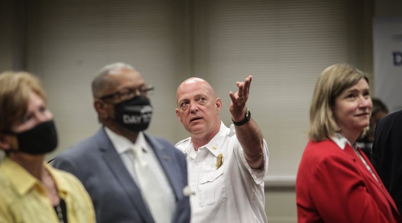 Dayton Police Major, Paul Saunders explains to Dayton city officials how the new internet tool will work. JIM NOELKER/STAFF