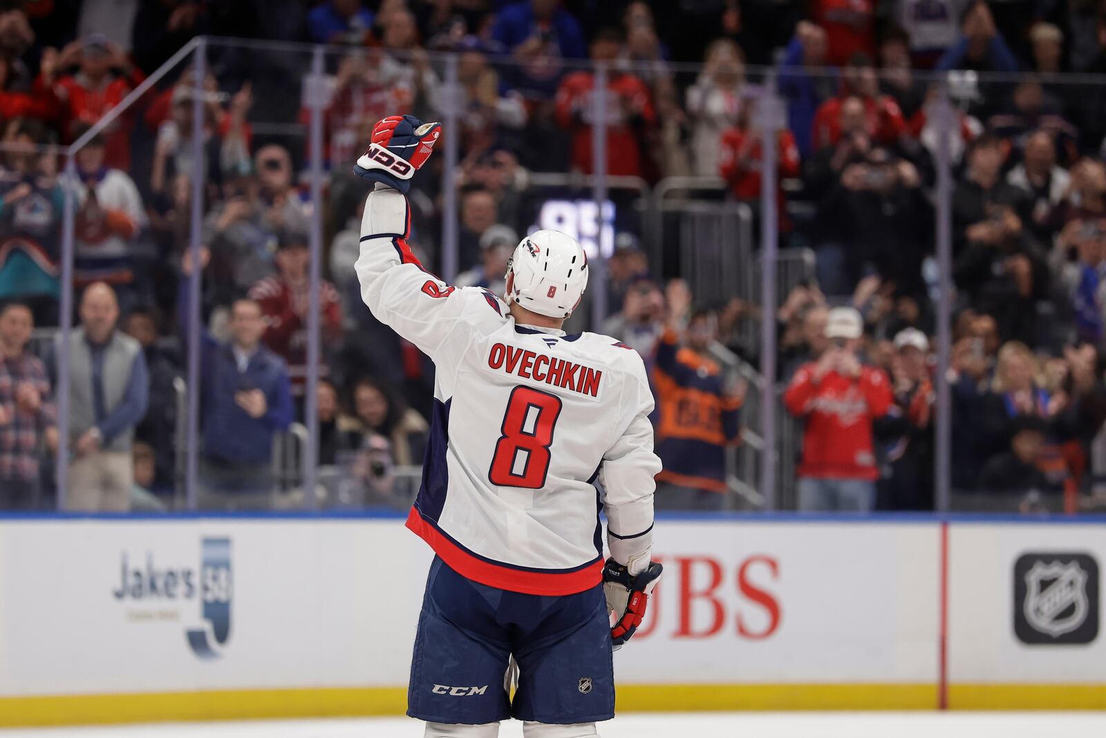 Washington Capitals left wing Alex Ovechkin (8) celebrates after scoring his 895th career goal during the second period of an NHL hockey game against New York Islanders in Elmont, N.Y., Sunday, April 6, 2025. (AP Photo/Adam Hunger)