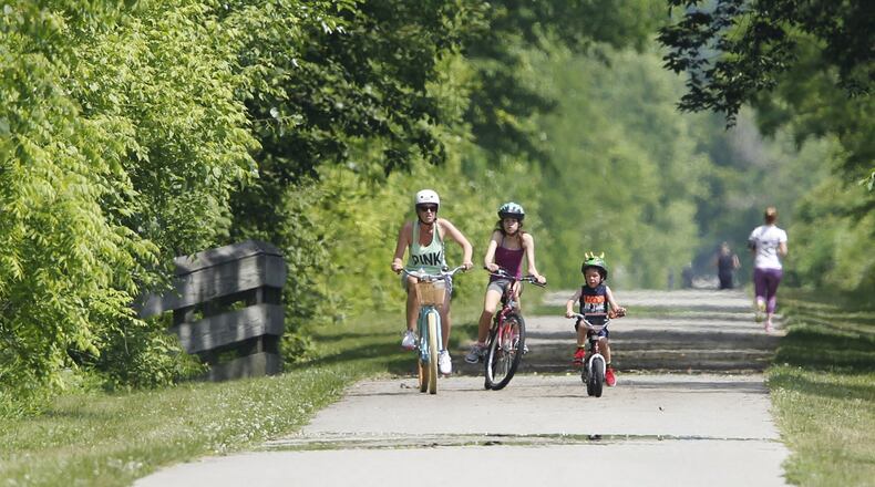 The Creekside Trail in Beavercreek that runs from Eastwood MetroPark to Xenia is approximately 18 miles. (source: TY GREENLEES / STAFF)