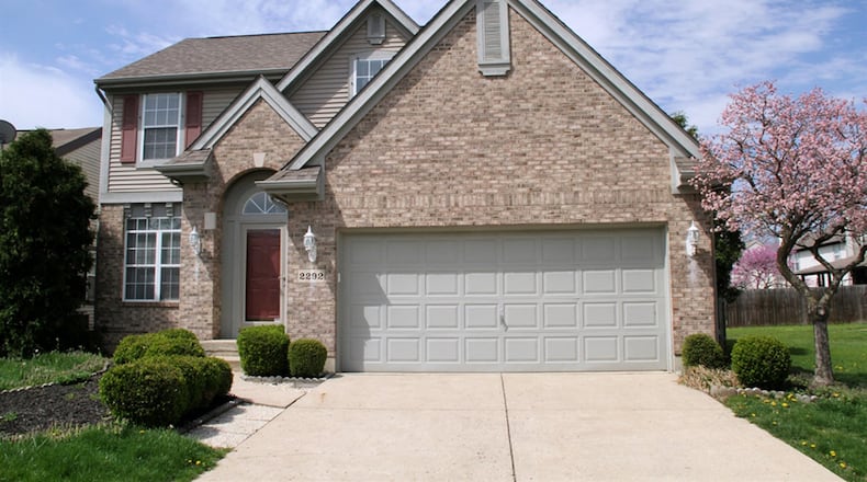 The 2-story, brick-and-vinyl house has an open floor plan with wood flooring, 4 upstairs bedrooms and a finished basement with recreation room and bonus room. CONTRIBUTED PHOTOS BY KATHY TYLER