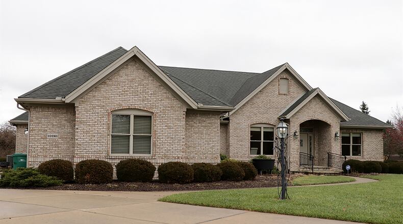 The brick home has about 4,130 sq. ft. of living space, including the finished basement. The house is located at the end of a cul-de-sac on a 0.91-acre lot. A concrete driveway leads to the 3-car, side-entry garage and extends for additional off-street parking. CONTRIBUTED PHOTO BY KATHY TYLER