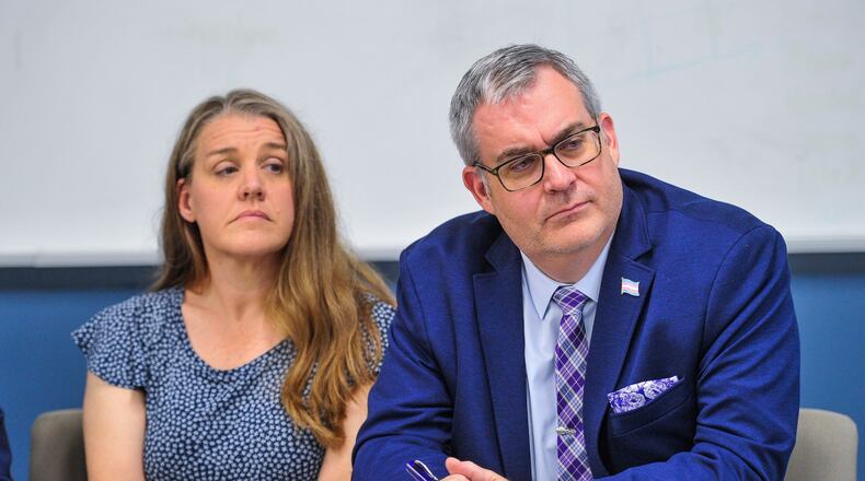 Stephanie and Kyle Whitaker show support for their child after attorneys Joshua Engel and Josh Langdon held a press conference to discuss a lawsuit against Warren County Common Pleas Court Judge Joseph Kirby. Engel and Langdon are representing several families who want to legally change the names of their transgender children. The lawsuit was filed against Warren County Common Pleas Court Judge Joseph W. Kirby in federal court. In June, Kirby denied a name change for a 15-year-old girl who identified as a boy, saying the change was premature. NICK GRAHAM/STAFF