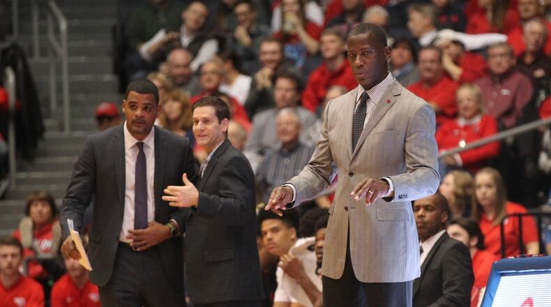 Dayton’s Anthony Grant, right, coaches during a game against Western Michigan as assistants Ricardo Greer, left, and Darren Hertz watch on Dec. 19, 2018, at UD Arena. David Jablonski/Staff