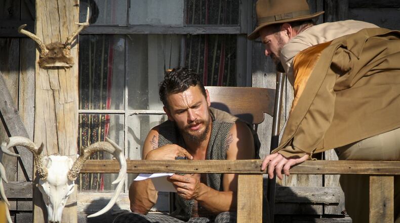 James Franco, the director and star of the movie The Long Home, talks with actor Garret Dillahunt between scenes staged at a farmhouse cabin in Shandon, Saturday, May 23, 2015. GREG LYNCH / STAFF