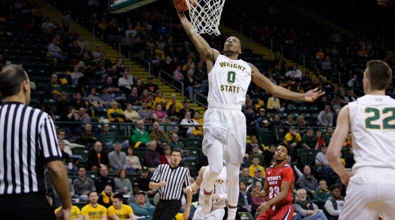 Wright State’s Steven Davis throwns down a dunk during Friday night’s victory against Detroit at the Nutter Center. TIM ZECHAR/SUBMITTED PHOTO