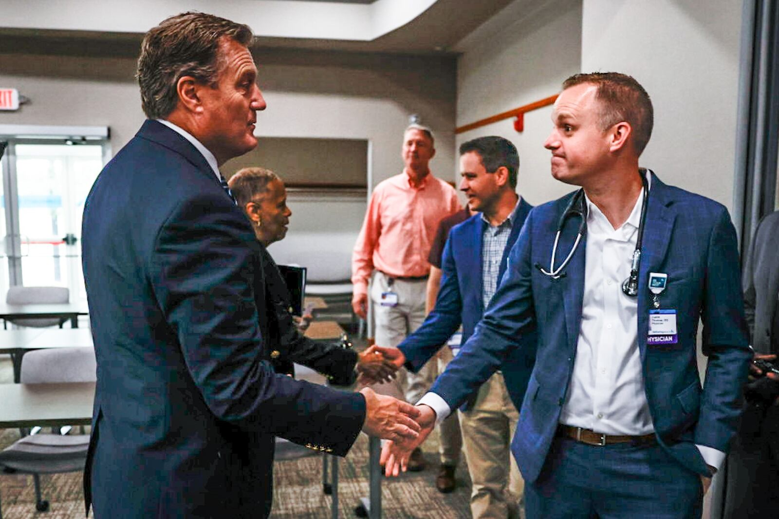Ohio congressman Mike Turner, left, shakes hands with Internal Medicine faculty, Justin Thomas after a press conference at the Cassano Health Center on Edwin C Moses Blvd. Wednesday August 9, 2023. Congressman Turner secured $1.25 million in direct federal funding for the Cassano Health Center's facility upgrade. JIM NOELKER/STAFF