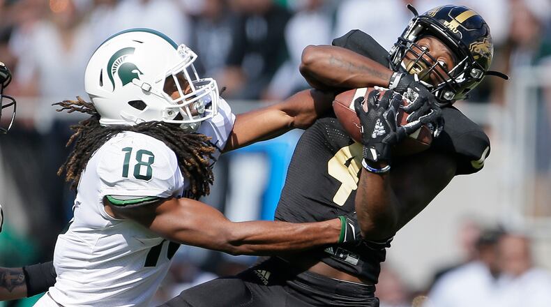 EAST LANSING, MI - SEPTEMBER 09: Cornerback Darius Phillips #4 of the Western Michigan Broncos intercepts a pass intended for wide receiver Felton Davis III #18 of the Michigan State Spartans during the first quarter at Spartan Stadium on September 9, 2017 in East Lansing, Michigan. (Photo by Duane Burleson/Getty Images)