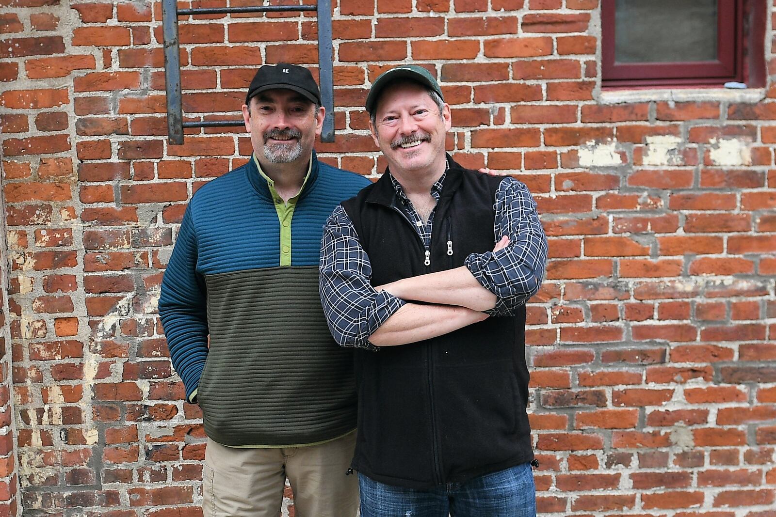 Peter Tompkins (left) of Cleveland included college friend and Tipp City artist Logan Roger in his documentary on artists in the Dayton area. CONTRIBUTED