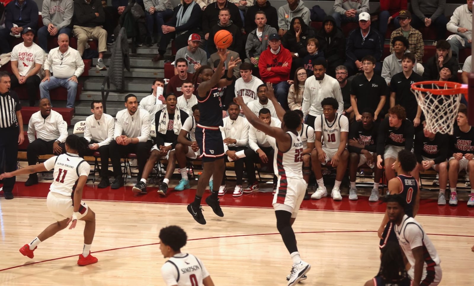 Dayton's Jaiun Simon makes a 3-pointer in the first half against Saint Joseph’s on Saturday, Jan. 24, 2026, at Hagan Arena in Philadelphia. David Jablonski/Staff