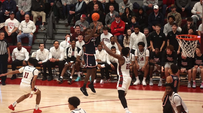 Dayton's Jaiun Simon makes a 3-pointer in the first half against Saint Joseph’s on Saturday, Jan. 24, 2026, at Hagan Arena in Philadelphia. David Jablonski/Staff
