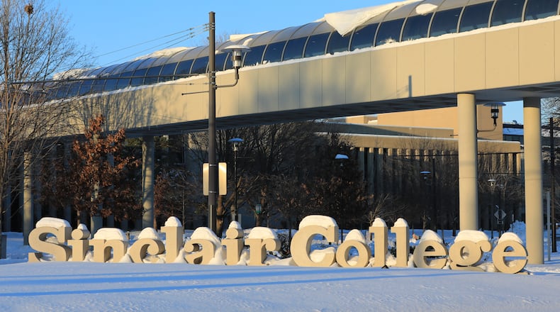 Sinclair Community College resumed in-person classes on Tuesday, about 36 hours after snow stopped Sunday evening. Much of the area received over a foot of snow. Most area universities had resumed in-person classes by Wednesday, though Wright State will continue to be remote by the end of the week. BRYANT BILLING/STAFF