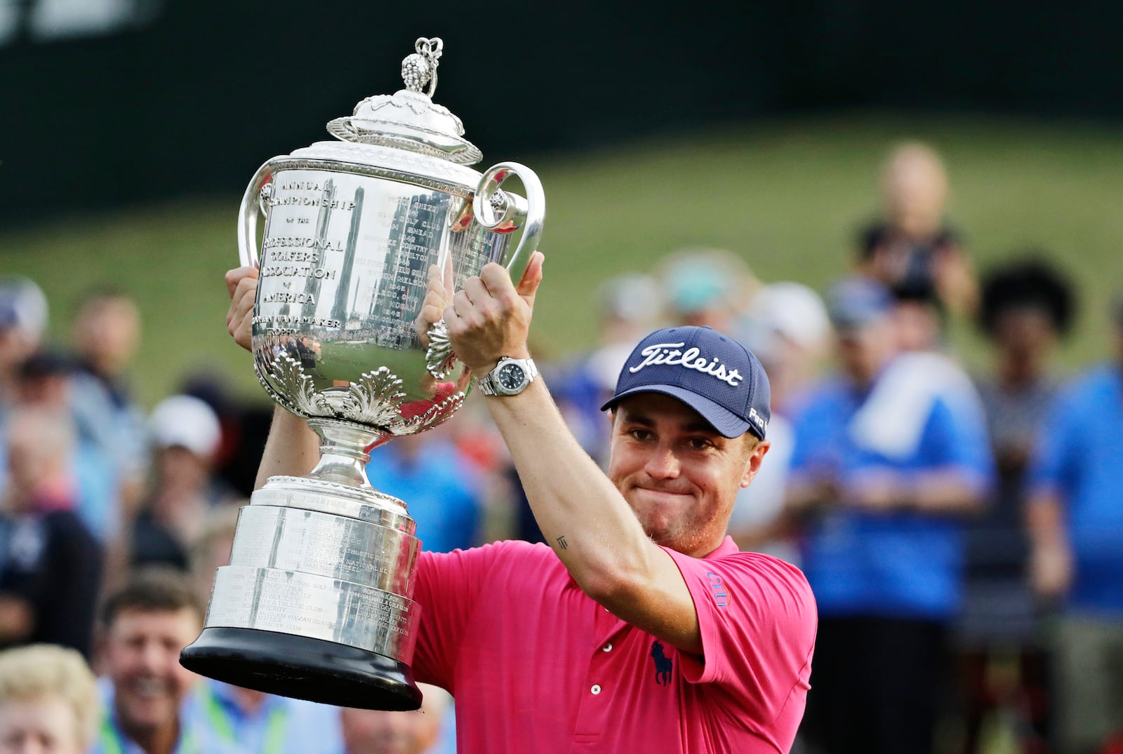 FILE - Justin Thomas poses with the Wanamaker Trophy after winning the PGA Championship golf tournament at the Quail Hollow Club Sunday, Aug. 13, 2017, in Charlotte, N.C. (AP Photo/Chris O'Meara, File)