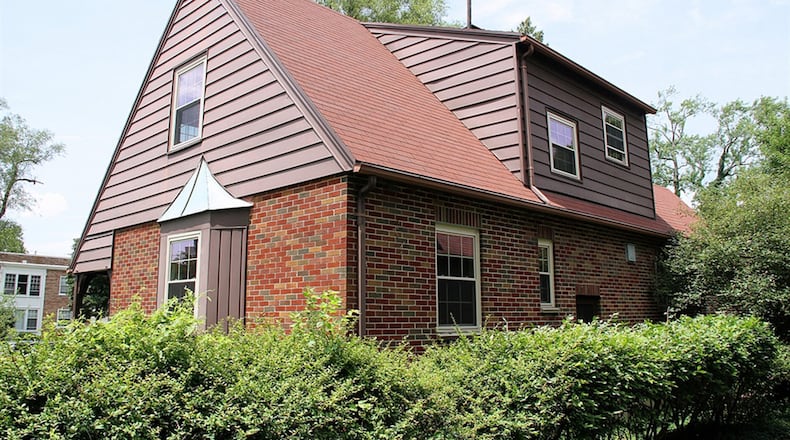 A door off the family room or possible first-floor bedroom opens to a covered porch.