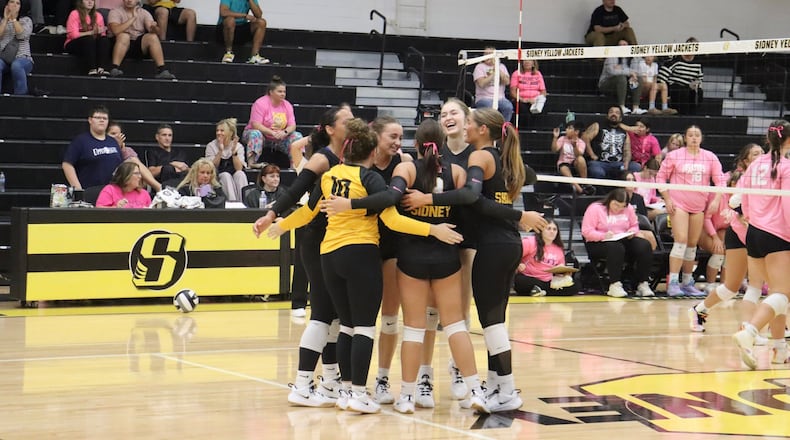 The Sidney girls volleyball team huddles together on the court during a recent game. CONTRIBUTED PHOTO