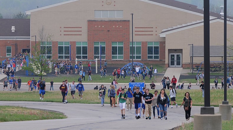 Springboro schools are among districts in Warren and Montgomery counties using social network scans for threats. Pictured is a 2016 evacuation of Springboro High School after a bomb threat.Staff photo by Marshall Gorby