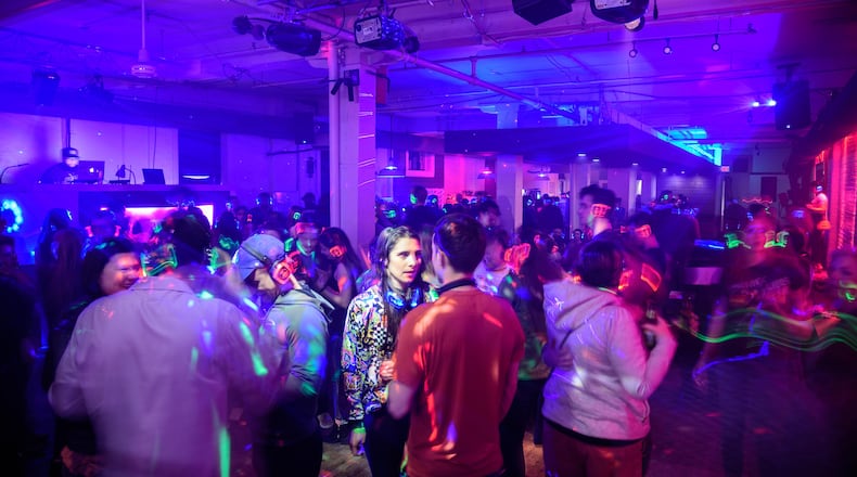 Therapy Cafe hosts a Silent Disco at 452 E 3rd St. in downtown Dayton monthly. The event is best described as a party for one, in a room of hundreds -- all you have to do is set your headphones and dance! The concept started in bigger cities and has been a traveling hit at large music festivals like Bonnaroo. TOM GILLIAM / CONTRIBUTING PHOTOGRAPHER