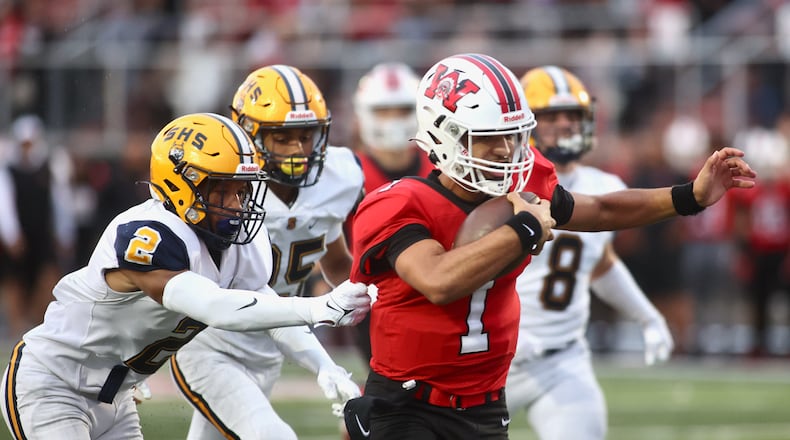 Wayne's Tyrell Lewis runs for a touchdown against Springfield in the second quarter on Friday, Sept. 8, 2023, in Huber Heights. David Jablonski/Staff