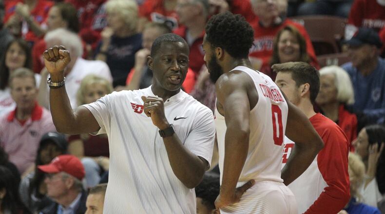 Dayton coach Anthony Grant talks to Josh Cunningham on Friday, Nov. 17, 2017, during a game against Ohio at TD Arena in Charleston, S.C. David Jablonski/Staff