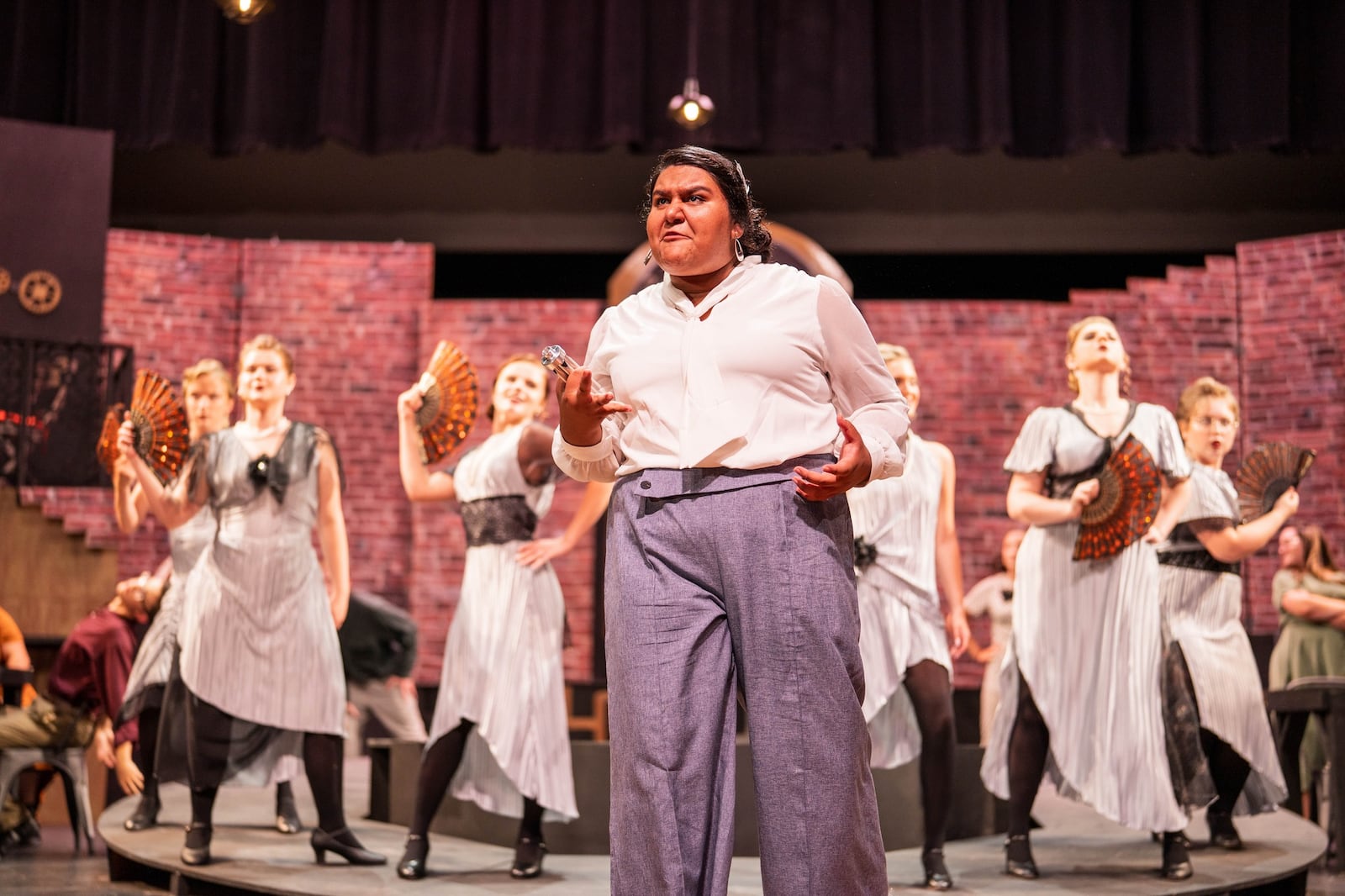 Haylie Chavez (Hermes) and the Fates in Vandalia Youth Theatre's production of "Hadestown: Teen Edition." Photo by Silver Studios Photo Video