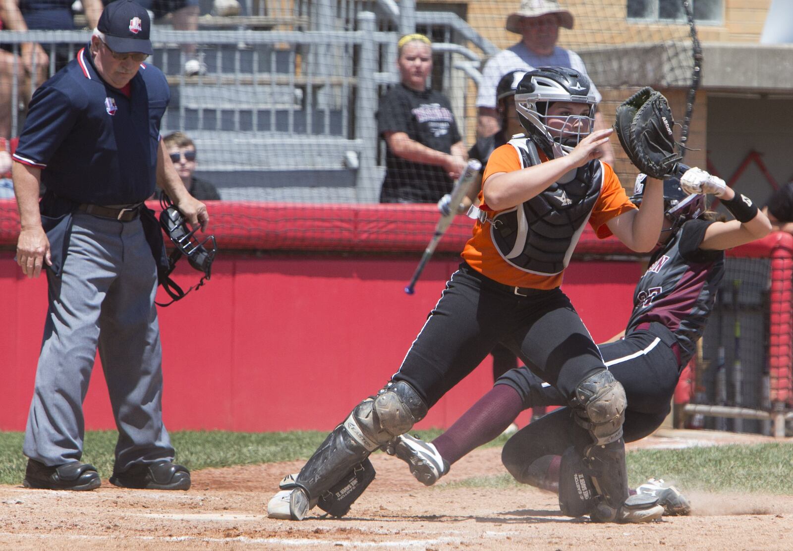 Lebanon’s Madison Hartman is safe at home plate during Thursday’s Division I state semifinal against North Canton Hoover at Firestone Stadium in Akron. Hartman appeared to be out on a force play, but home-plate umpire Paul Offenbacher ruled that Hoover catcher Laurel DeVoe missed home plate on the play. ROBERT ROSSITER/THE CANTON REPOSITORY