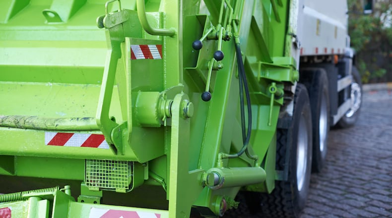 A rear-view shot of a garbage truck. ISTOCK